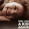 Young child smiling – feel like a kid again