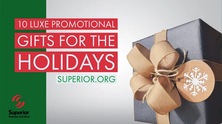Silver gray holiday gift box with bow and ribbon and snowflake tag