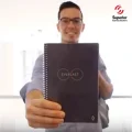 Man holding custom notebook promotional gift with imprinted logo